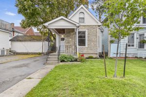Single detached home in Kingston’s Williamsville neighbourhood with stone façade and front porch