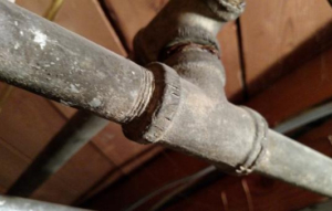 Corroded galvanized steel plumbing pipe found during a Kingston Ontario home inspection | Century 21 Lanthorn Real Estate Ltd.