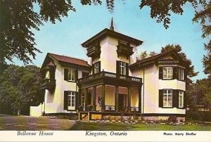 Historic postcard view of Bellevue House in Kingston, Ontario, a white stucco villa with Italianate architecture and a central tower.