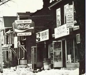 Vintage photo of Freddie’s Grocery and Chung Wah restaurant near Queen’s University campus in Kingston.