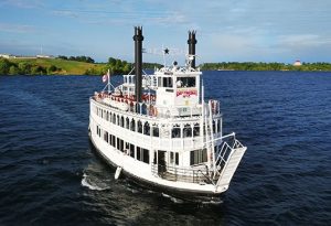 The Island Queen cruise boat sailing on the St. Lawrence River near Kingston waterfront.