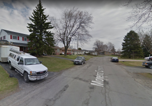 Residential street view of Morenz Crescent in Rideau Heights Kingston with homes, vehicles, and mature trees
