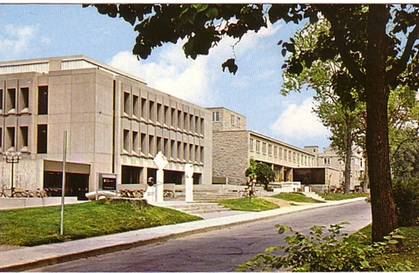 West side of University Avenue on Queen’s University campus in Kingston, Ontario, circa 1970, showing modern concrete and stone academic buildings.