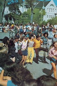 Queen’s University students linking arms and dancing the Oil Thigh during Frosh Week