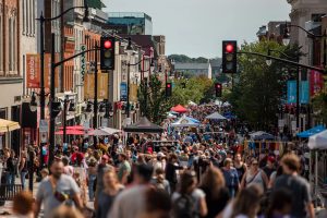 Crowds walking along Princess Street during Kingston’s one of the Princess Street Promenades.