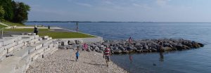Families enjoying a summer evening at Lake Ontario Park in Kingston, Ontario