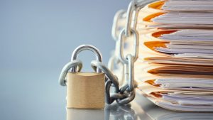 Confidential real estate documents secured with lock and chain
