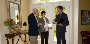 Working with a realtor in Kingston reviewing listing documents with clients