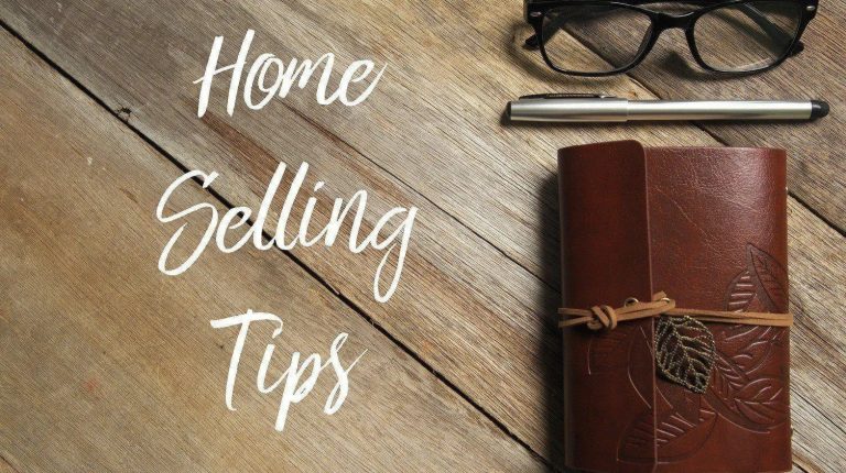 Notebook, glasses, and pen with text Home Selling Tips for Kingston real estate