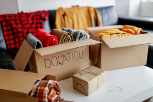 Boxes of clothes ready for donation, a common step in downsizing your home in Kingston and Napanee