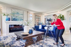 Professional real estate photographer capturing interior photos of a staged Kingston home for listing presentation