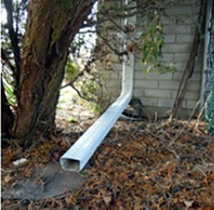 Downspout extension carrying rainwater away from a house foundation to prevent water damage in Kingston, Bill Stevenson, REALTOR®, Century 21 Lanthorn Real Estate Ltd., Brokerage