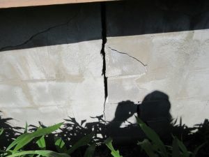 Serious vertical foundation crack and shifting exterior block wall showing a significant water damage and structural risk in a Kingston home, Bill Stevenson, REALTOR®, Century 21 Lanthorn Real Estate Ltd., Brokerage