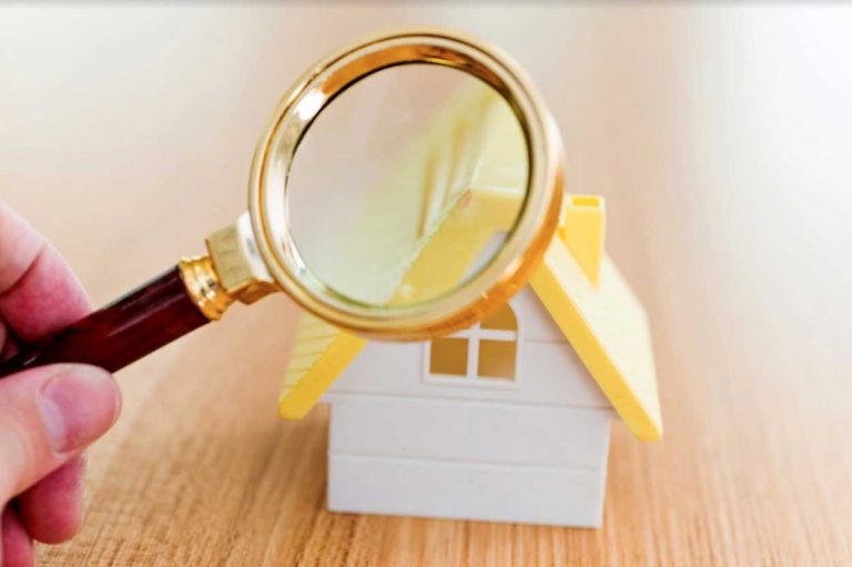 Home inspection concept with magnifying glass and house model, Bill Stevenson, REALTOR, Century 21 Lanthorn Real Estate Ltd Brokerage, Kingston Ontario
