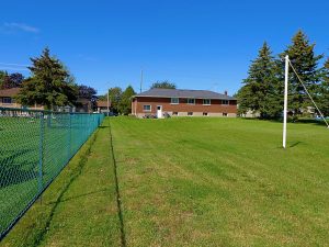 Large residential lot in the Westbrook area of Kingston, showing open yard space and mature surroundings. Bill Stevenson, REALTOR, Century 21 Lanthorn Real Estate Ltd., Brokerage.