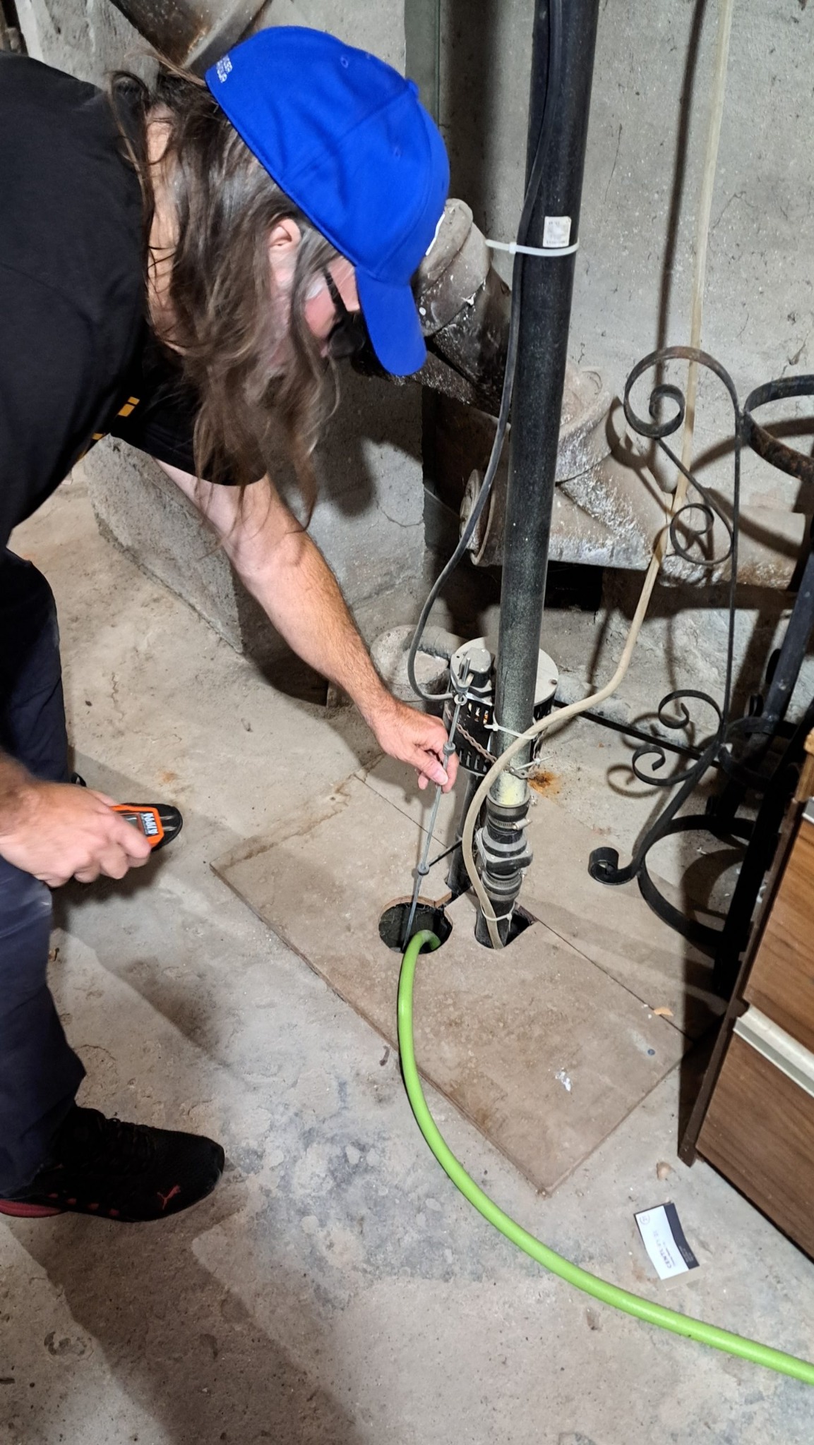 Sump pump inspection during a pre-listing home inspection in Kingston and area