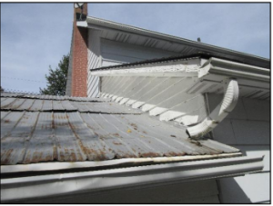 Aged roof showing rust and deterioration on metal panels, photographed during a Kingston home inspection. Bill Stevenson, REALTOR®, Century 21 Lanthorn Real Estate Ltd, Brokerage.