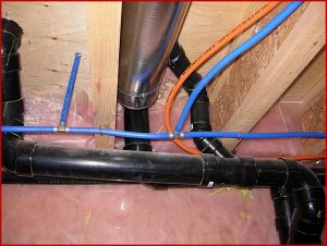 Blue and orange TPFX and PEX water lines in a Kingston area basement, showing modern piping that is sometimes mistaken for Kitec, Bill Stevenson REALTOR, Century 21 Lanthorn Real Estate Ltd, Brokerage