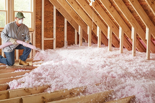 Blown-in attic insulation being installed in a Kingston and Area home, an upgrade often recommended by Bill Stevenson, REALTOR®, Century 21 Lanthorn Real Estate Ltd., Brokerage.