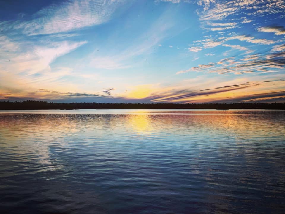 People are moving to the area for views like this Sunset over a lake north of Kingston Ontario in Frontenac County