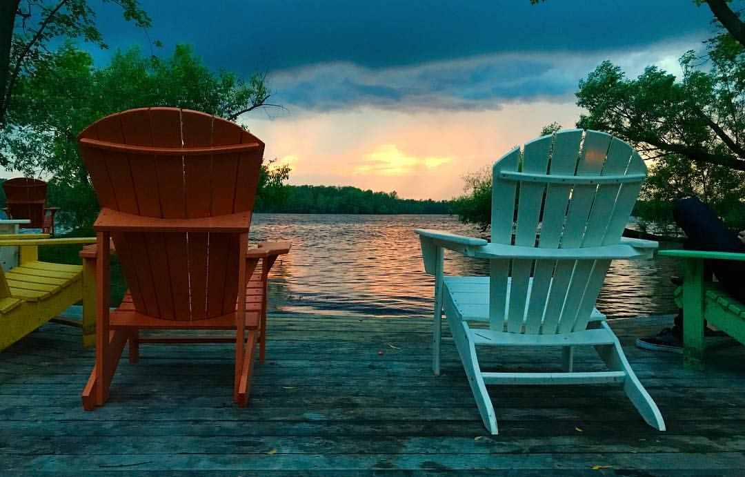 Waterfront chairs overlooking lake at sunset in Kingston area, Bill Stevenson REALTOR® Century 21 Lanthorn Real Estate Ltd Brokerage