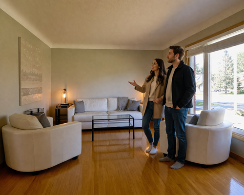 Bill Stevenson REALTOR® couple viewing living room home buying decision
