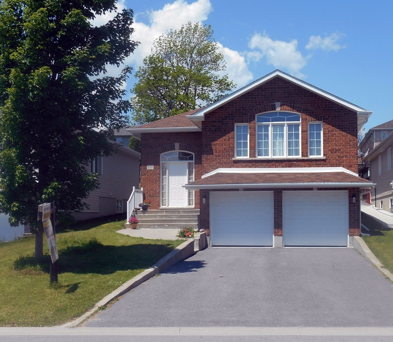 Detached brick home similar to properties Kingston buyers search when asking home buying questions
