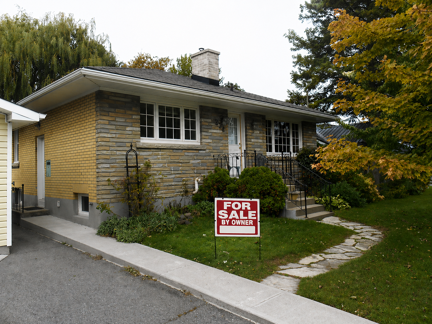 Self-represented seller FSBO sign in front of Kingston home with landscaped yard