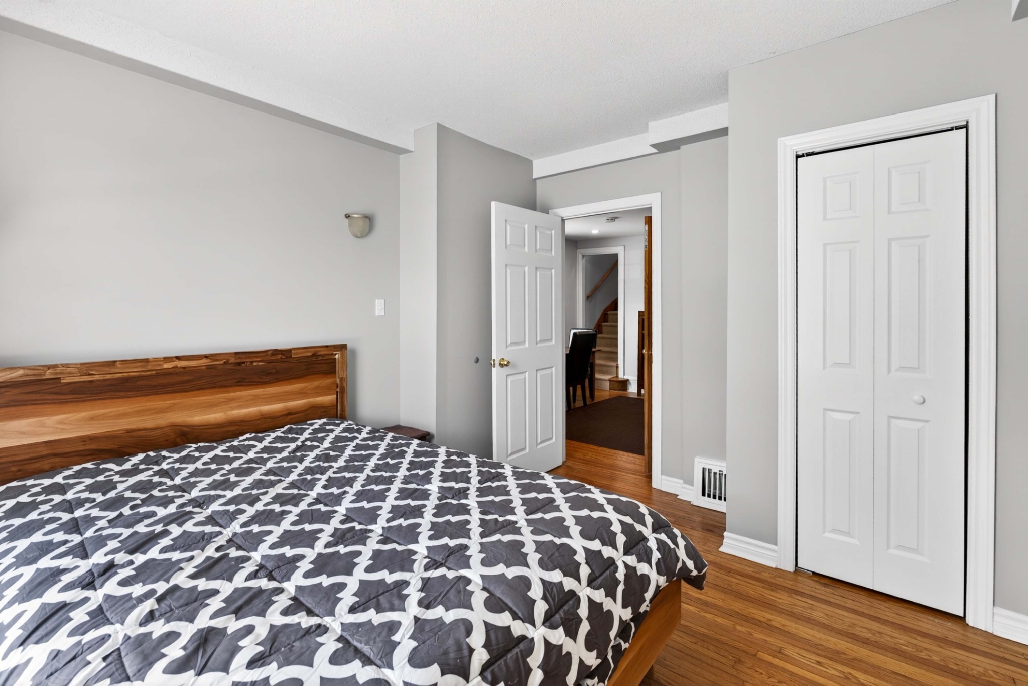 Bright bedroom with hardwood flooring at 23 Jenkins Street in Kingston’s Williamsville neighbourhood