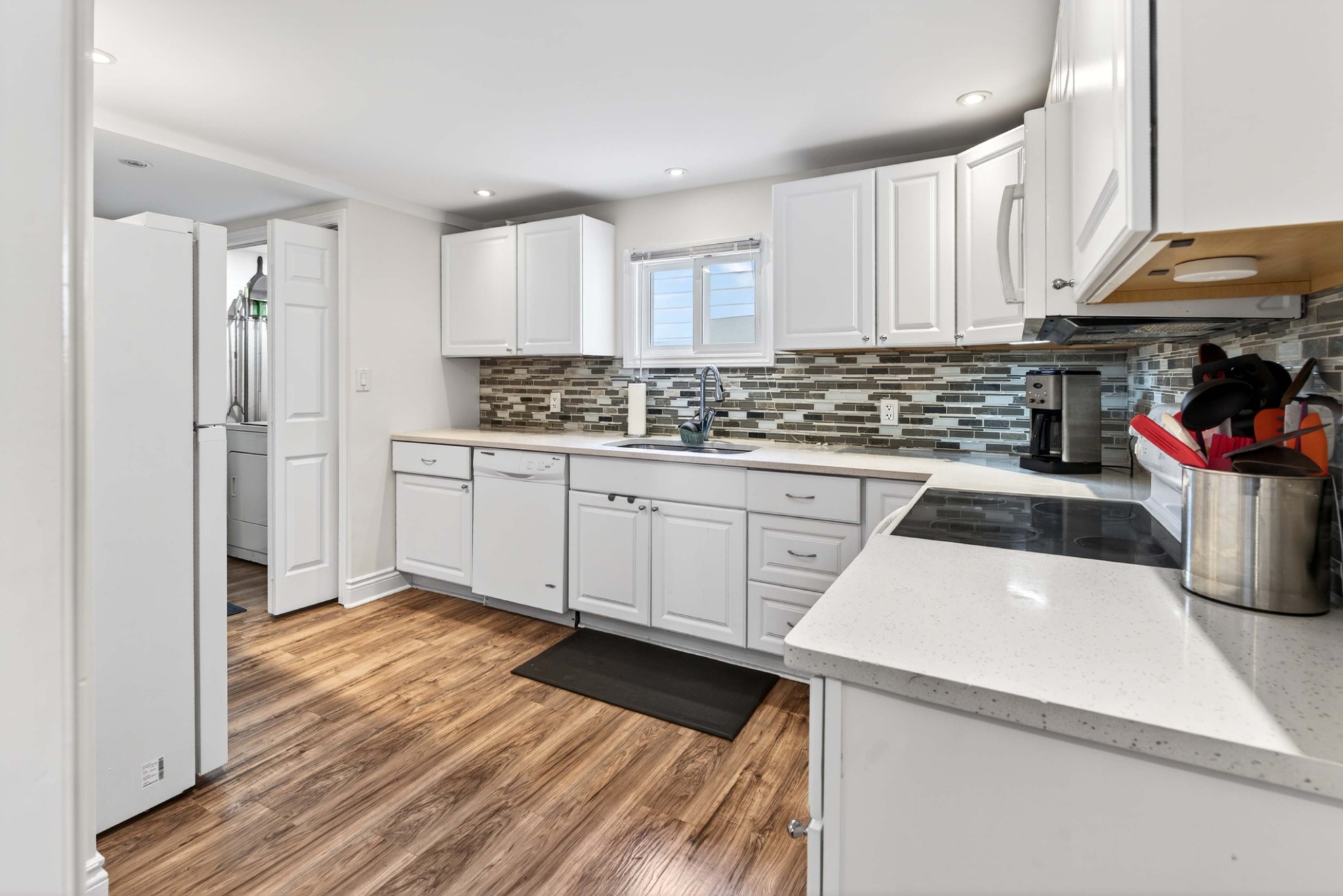 Updated kitchen with quartz countertops at 23 Jenkins Street in Kingston’s Williamsville neighbourhood
