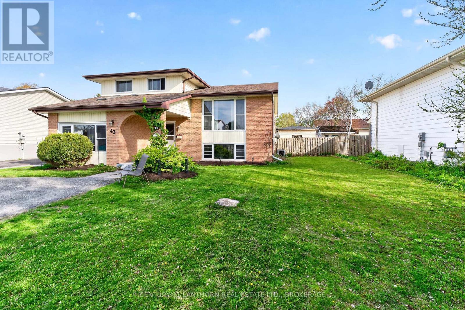 Spacious 4-bedroom side-split family home with large front yard in Amherstview Ontario