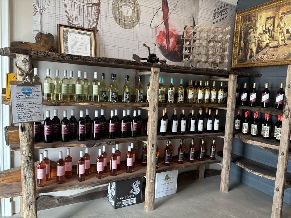 Beer, wine, and ready-to-drink beverages displayed in modern retail coolers.