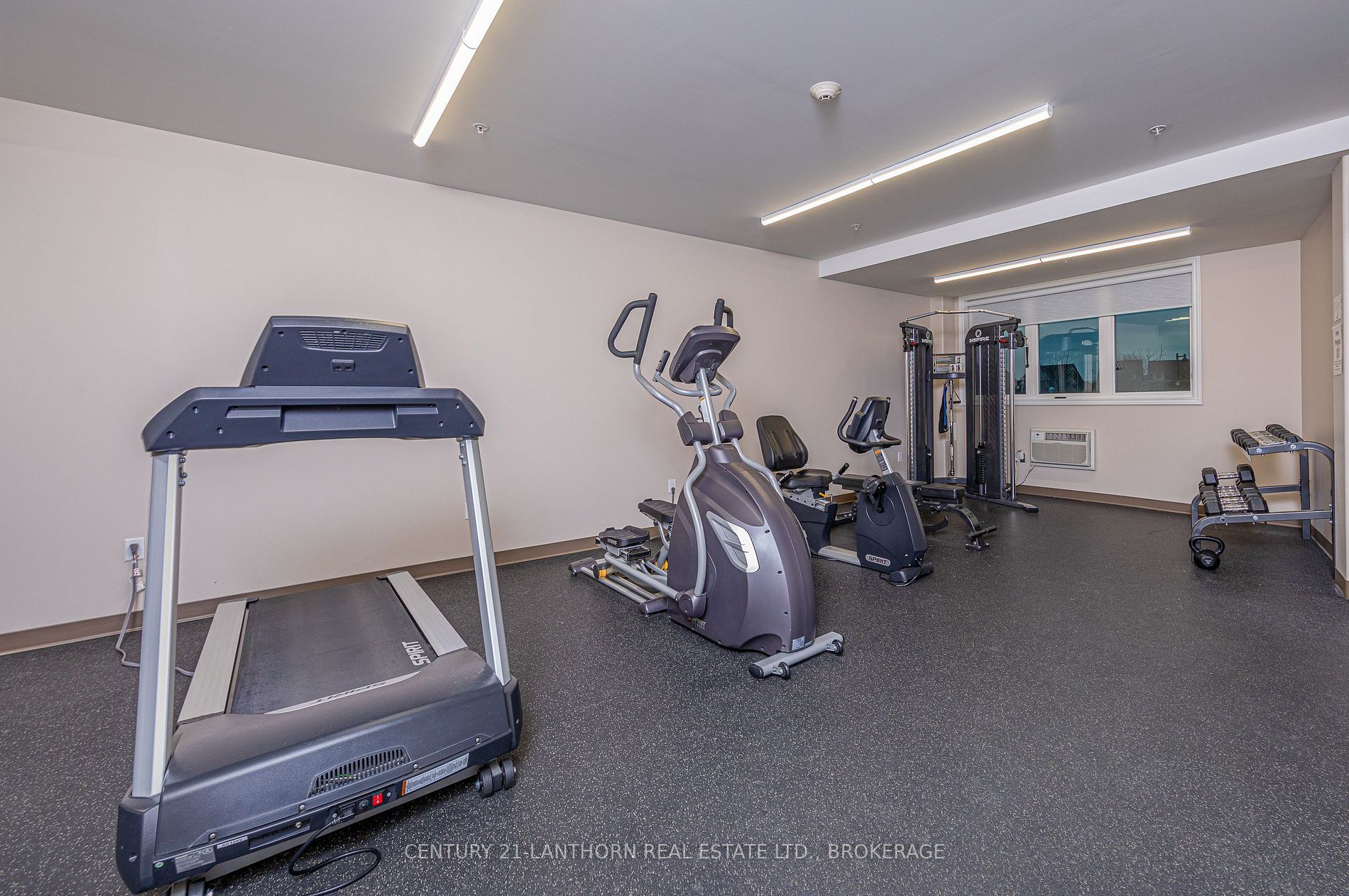 Fitness room with treadmill and exercise equipment in a Kingston Ontario condominium building