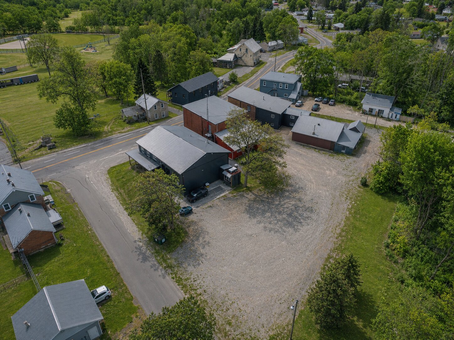 Commercial property in Lyn Ontario aerial view showing building, parking area, and surrounding community