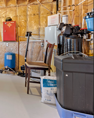 Modern rural home water treatment system with water softener, filtration equipment, pressure tank, and mechanical systems in Kingston and Area that a buyer looks for