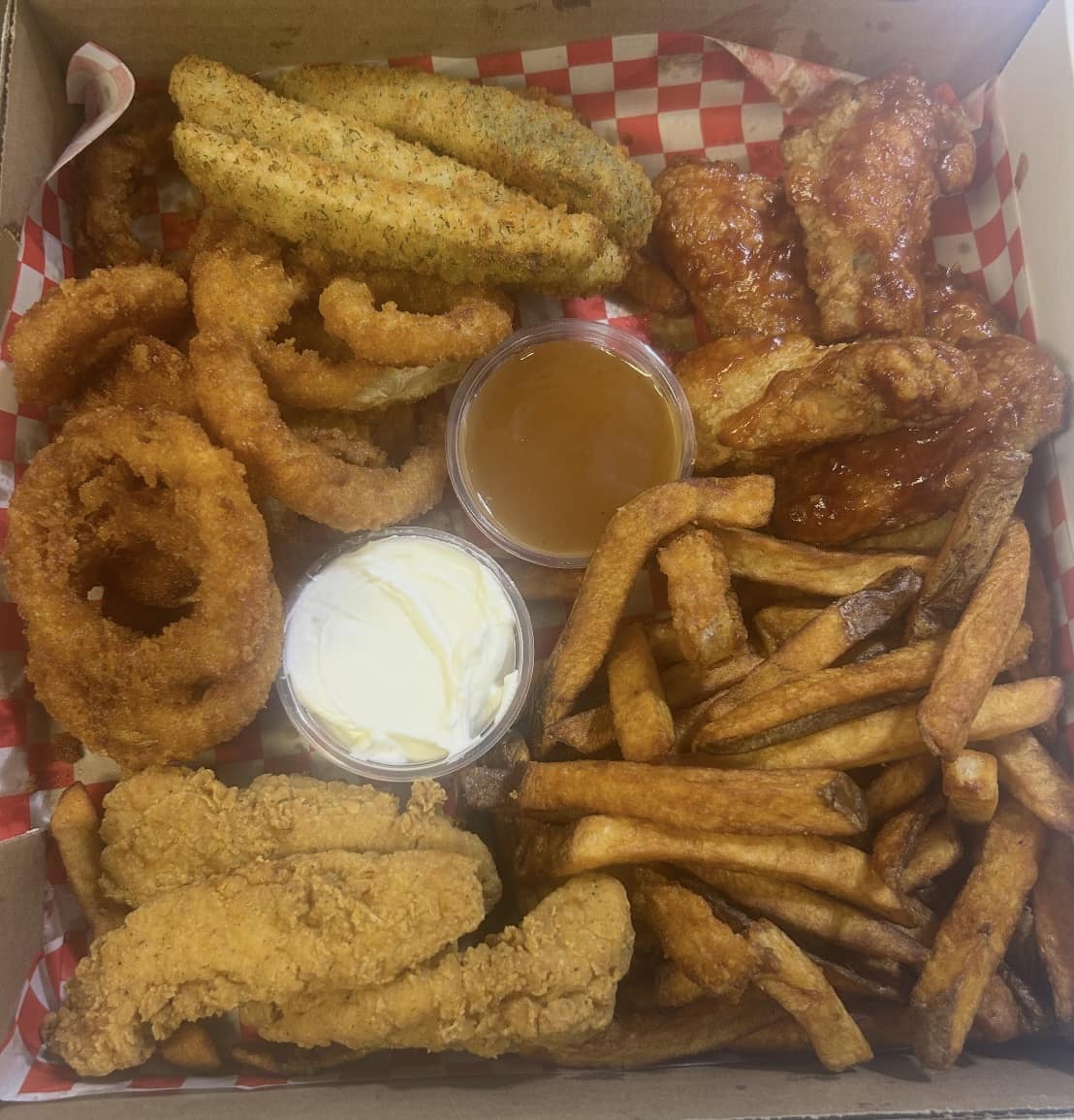 Prepared takeout party platter with snack foods and appetizers from Chit Chat Convenience and Pizzeria in Lyn Ontario.