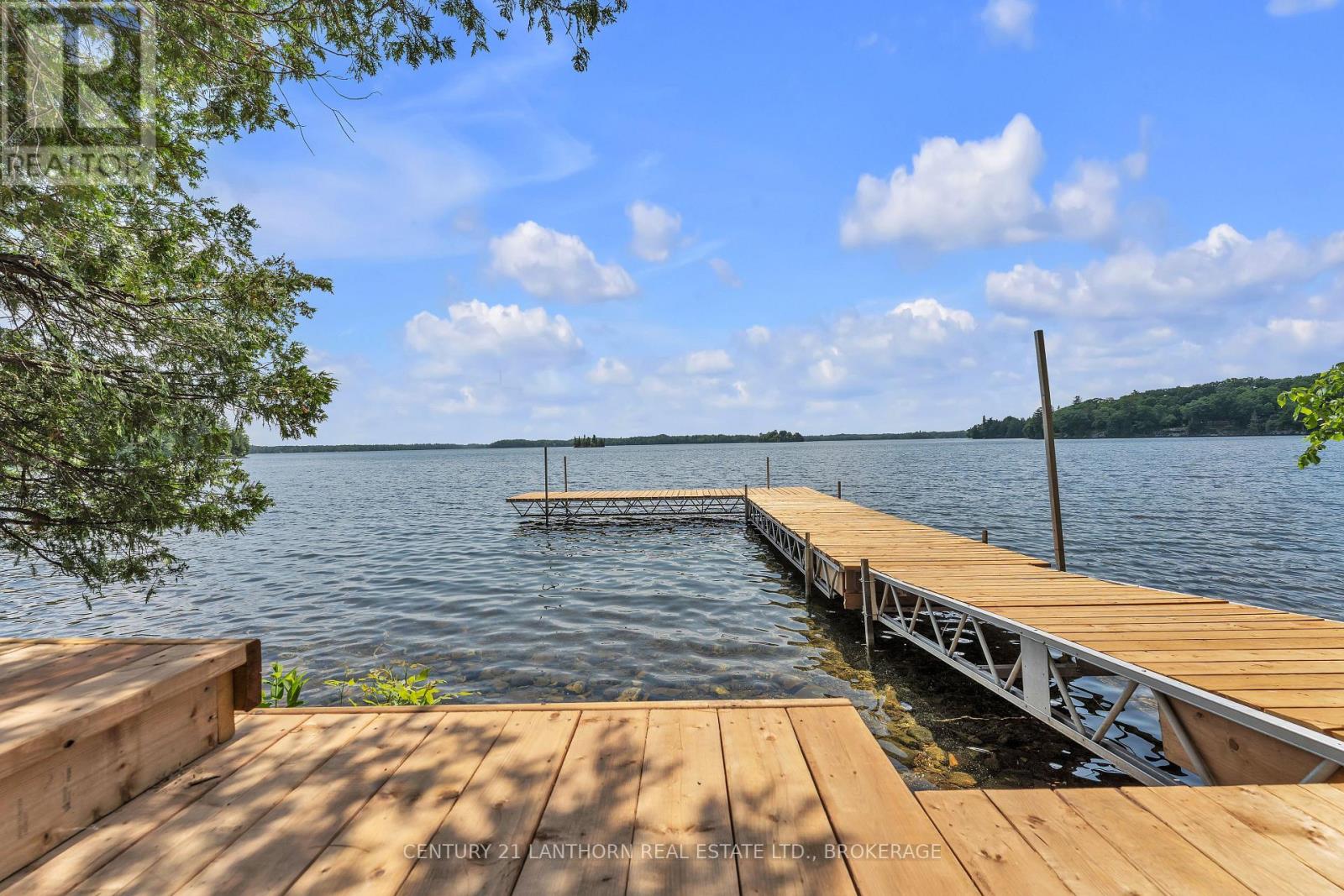 Kingston area waterfront home featuring a private dock and expansive lake views