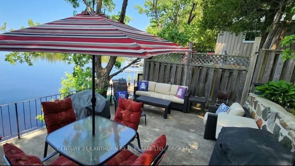 Kingston area homes $600K - $900K featuring a waterfront patio and outdoor living space