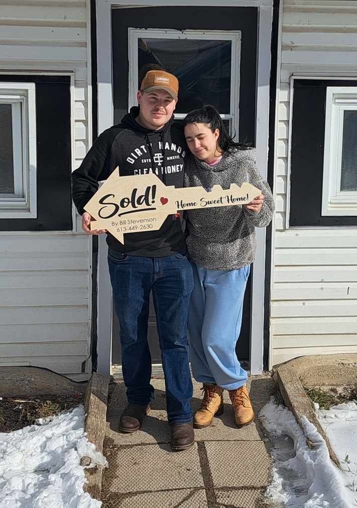 Happy home buyers after successful home sale negotiations