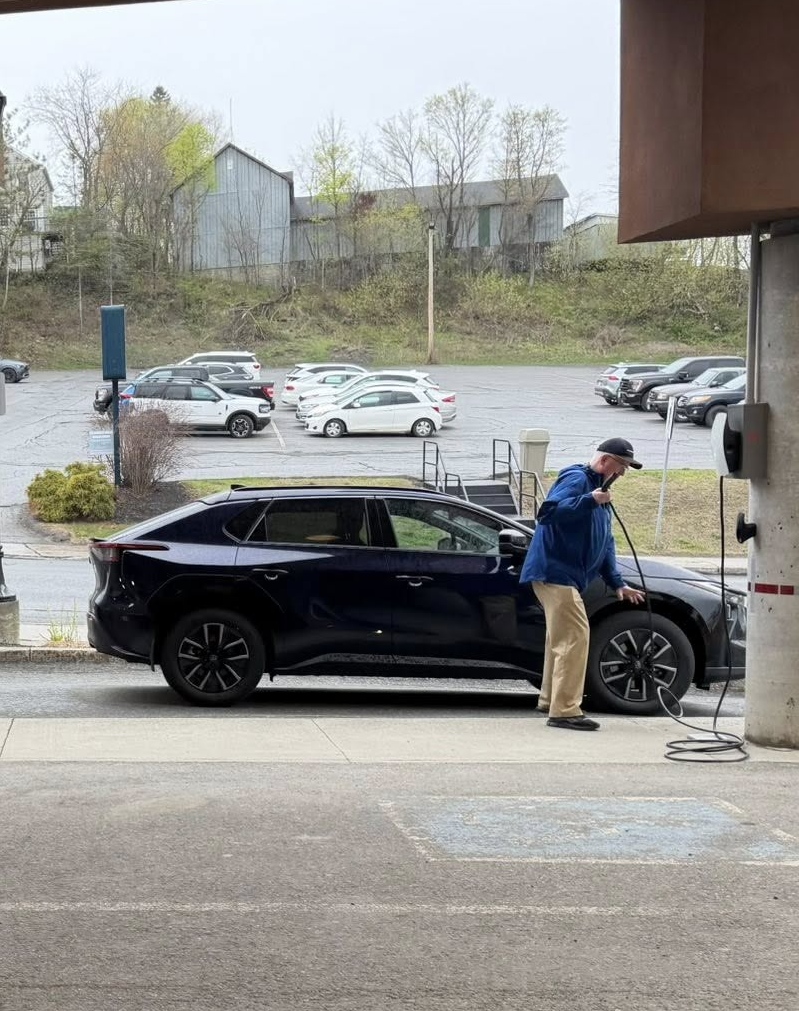 Moving to a small town, electric vehicle charging at a public charging station, highlighting EV ownership and charging considerations for rural and small-town living. Bill Stevenson, REALTOR®, Century 21 Lanthorn Real Estate Ltd., Brokerage.