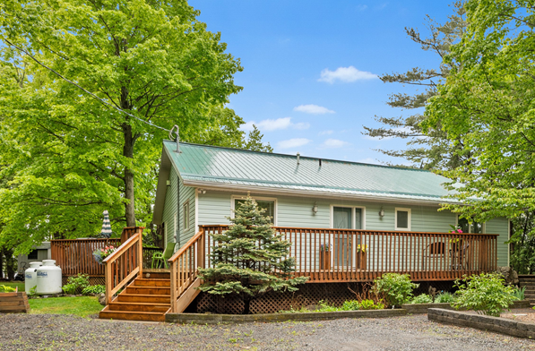 Bill Stevenson, REALTOR®, Century 21 Lanthorn Real Estate Ltd., Brokerage. Rural home with propane tanks illustrating rural heating systems commonly found throughout Kingston and Area.