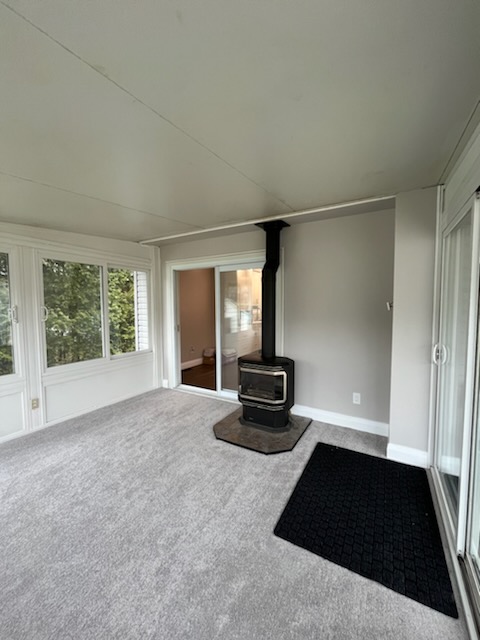 Bill Stevenson, REALTOR®, Century 21 Lanthorn Real Estate Ltd., Brokerage. Wood stove providing supplemental heat as part of rural heating systems in a Kingston and Area home.