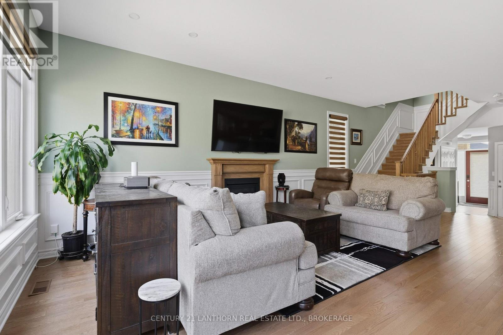 Living room with fireplace in townhouse at 1650 Tenley Drive, Kingston
