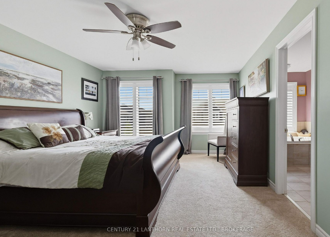 Primary bedroom in a three-bedroom Woodhaven townhome at 1650 Tenley Drive