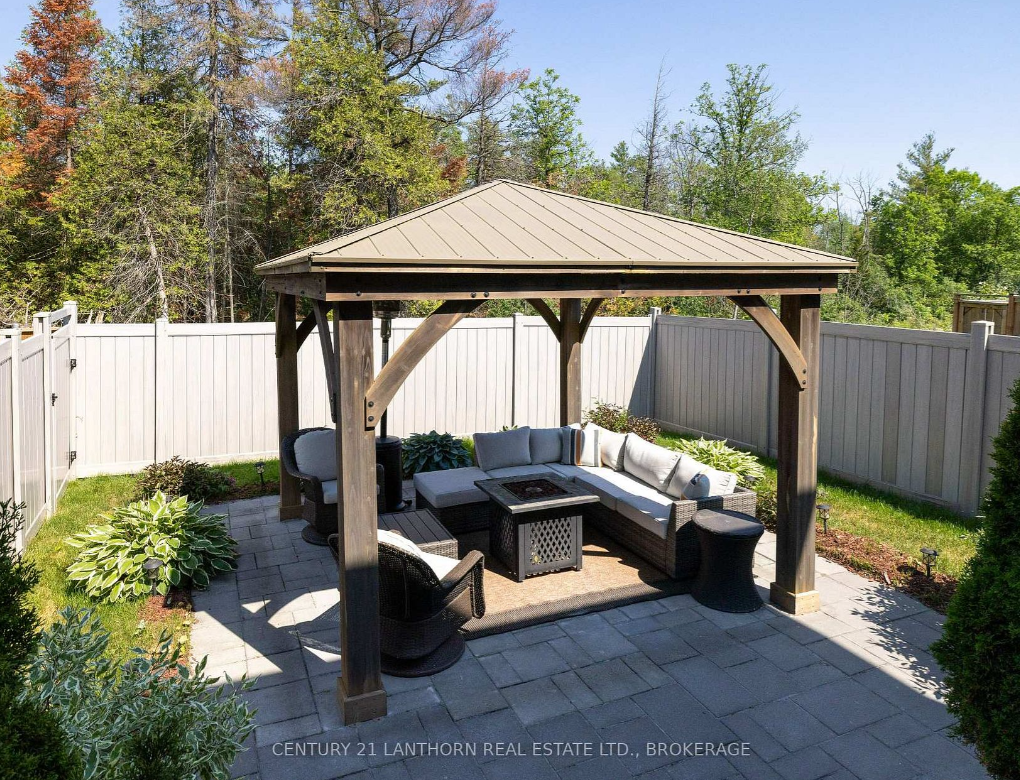 Fenced backyard and gazebo at a three-bedroom Woodhaven townhome at 1650 Tenley Drive