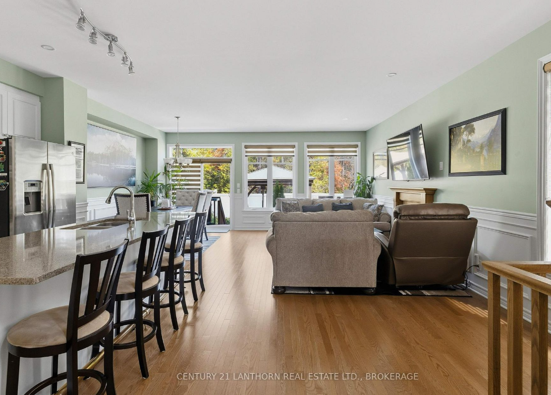 Open-concept kitchen, dining, and living area at 1650 Tenley Drive in Woodhaven