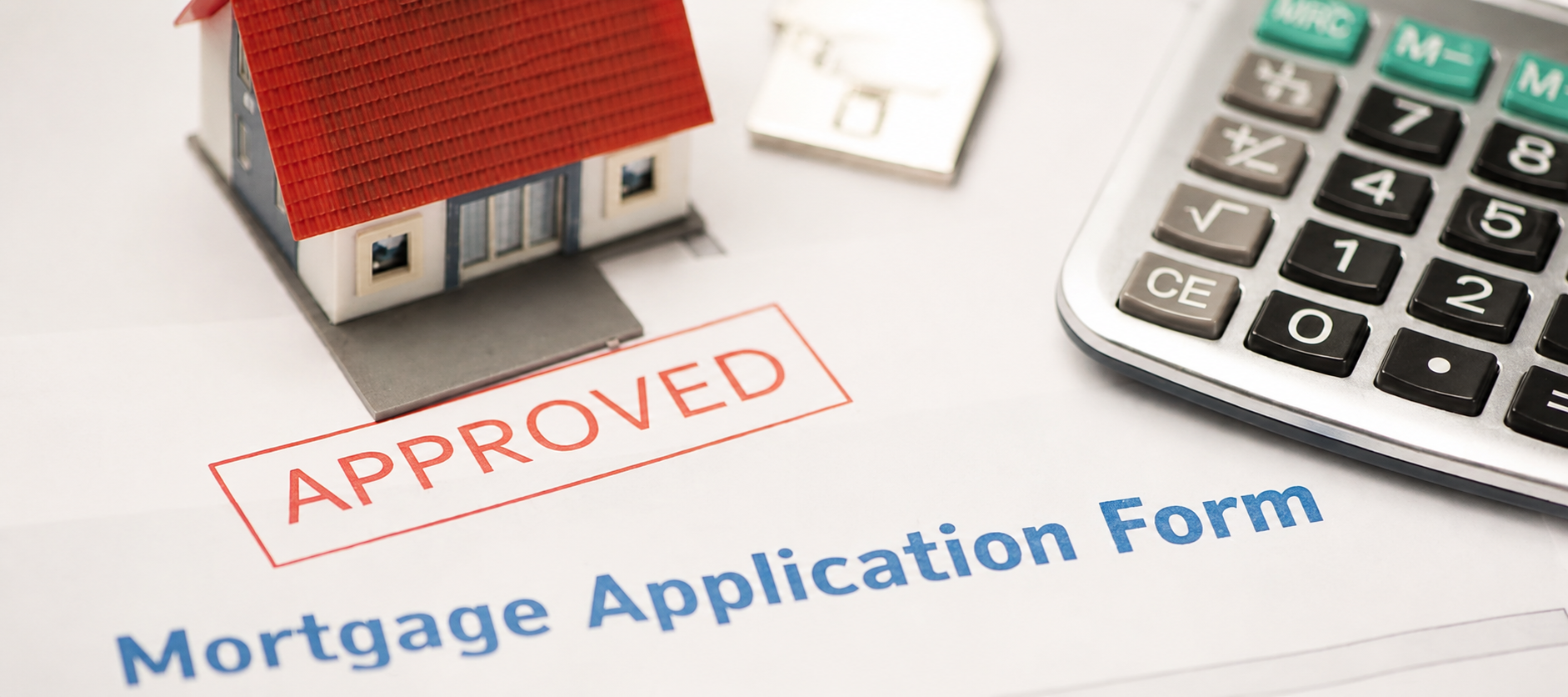 Mortgage application approval image representing co-signing a mortgage and the risks of shared financial responsibility.