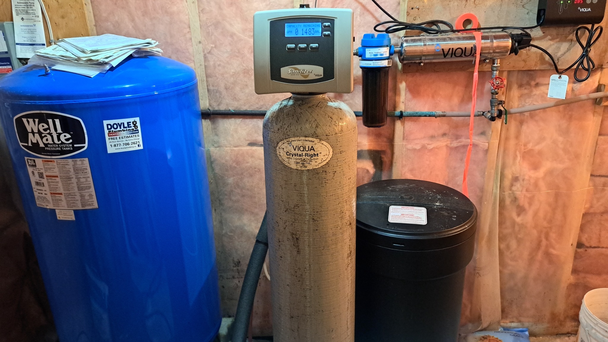Pressure tank, water treatment equipment, and UV filtration system in a rural home, showing private water infrastructure that can affect rural financing.